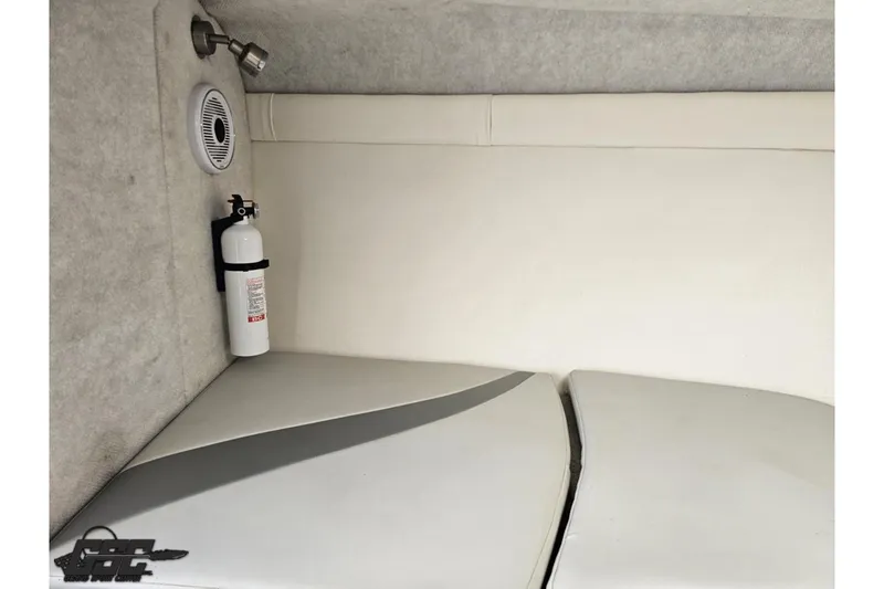 Slide: The Image of Interior of a 2004 Baja H2X boat cabin with fire extinguisher and speaker. - 69