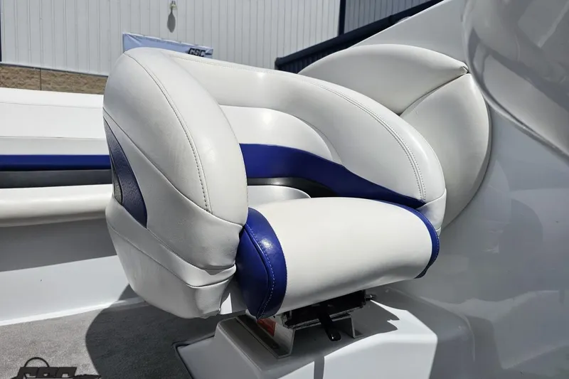 Slide: The Image of White and blue cushioned seat in a 2004 Baja H2X boat. - 77