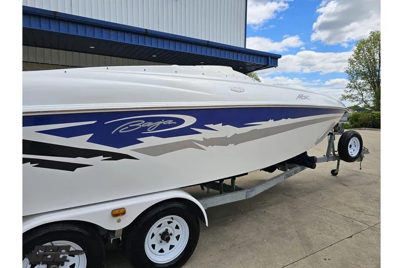 Slide: The Image of 2004 Baja H2X speedboat on trailer, featuring sleek design and vibrant graphics. - 8