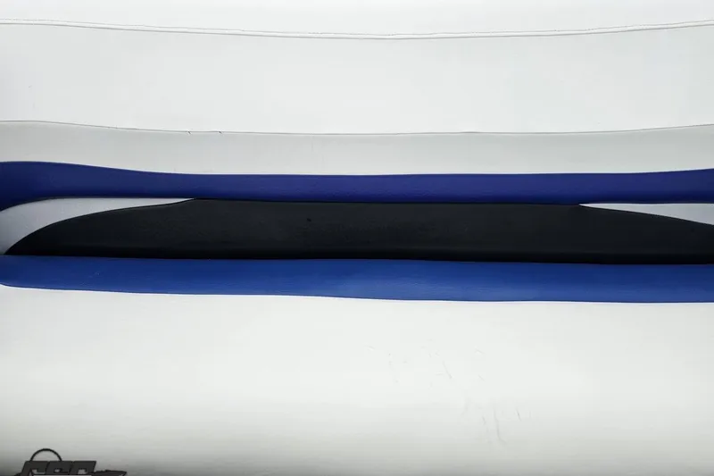 Slide: The Image of 2004 Baja H2X boat seat with blue, black, and white upholstery design. - 82