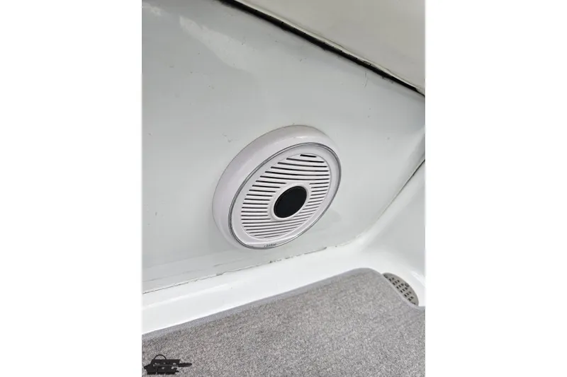 Slide: The Image of 2004 Baja H2X boat interior speaker detail, white and gray design. - 84