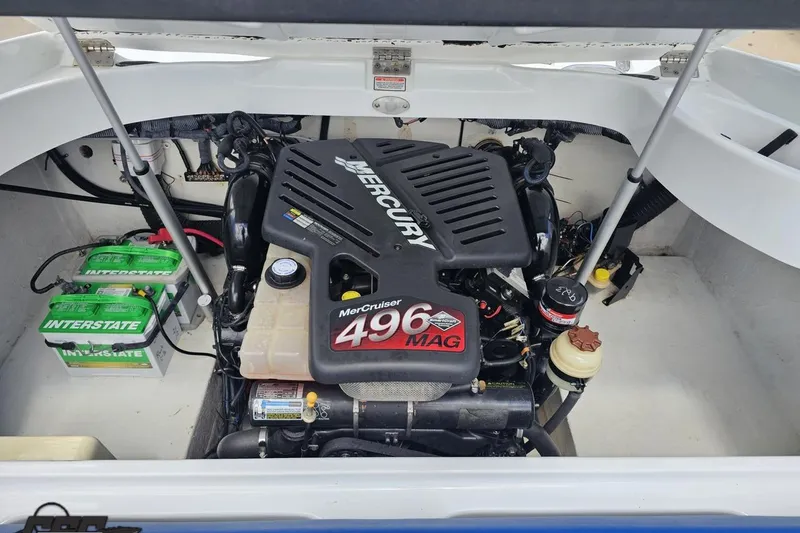 Slide: The Image of 2004 Baja H2X boat engine compartment with MerCruiser 496 MAG engine and Interstate batteries. - 87