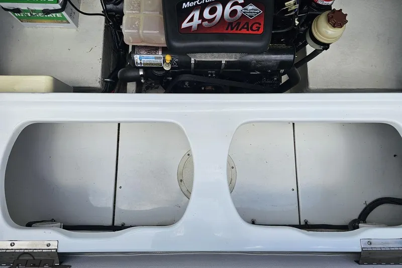 Slide: The Image of Engine compartment of a 2004 Baja H2X boat featuring a MerCruiser 496 MAG engine. - 88