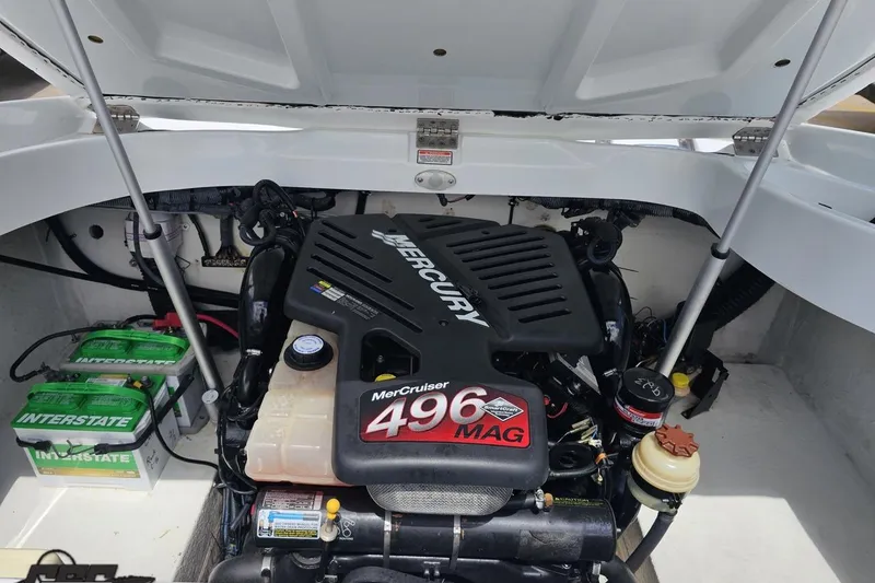Slide: The Image of 2004 Baja H2X boat engine compartment featuring a MerCruiser 496 MAG engine. - 90