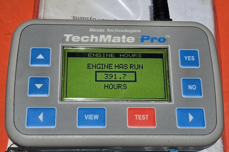 Slide: The Image of Rinda Technologies TechMate Pro displaying 391.7 engine hours for 2004 Baja H2X. - 92