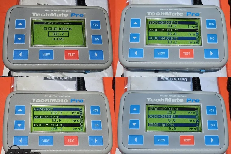 Slide: The Image of TechMate Pro engine diagnostic tool displaying RPM hours for a 2004 Baja H2X. - 93