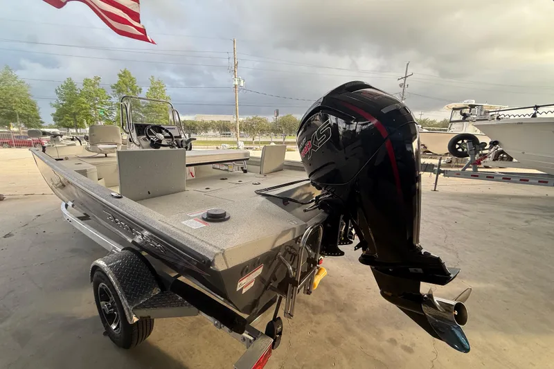 Slide: The Image of 2026 Ranger RB190 boat with powerful outboard motor, parked under cloudy sky. - 9