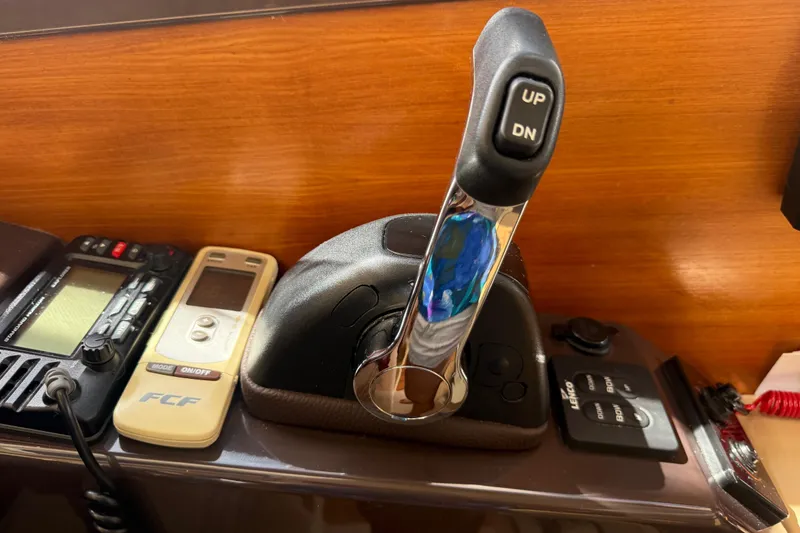 Slide: The Image of Control panel of a 2019 Ranger Tugs R-27 boat with throttle lever and electronic devices. - 30