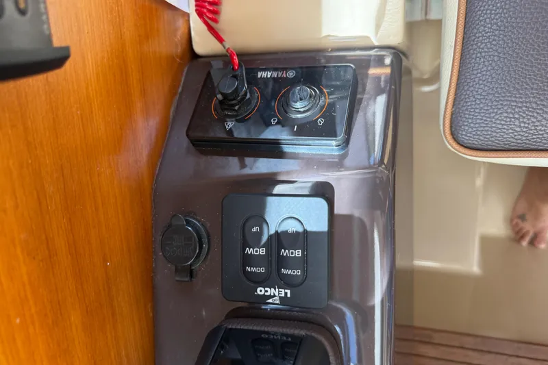 Slide: The Image of Control panel of a 2019 Ranger Tugs R-27 boat with Yamaha and Lewmar controls. - 31