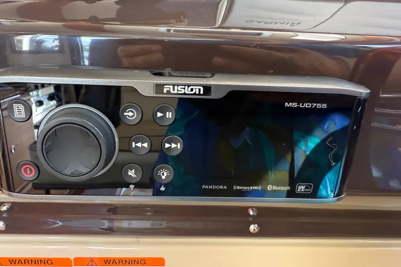 Slide: The Image of Fusion MS-UD755 audio system on 2019 Ranger Tugs R-27 boat dashboard. - 33