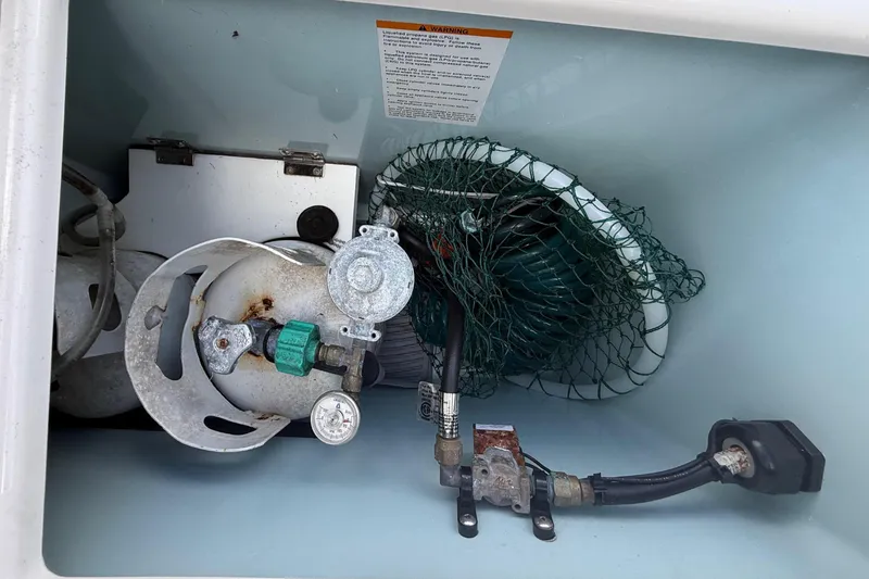 Slide: The Image of Propane tank and accessories in Ranger Tugs R-27, 2019 model. - 43