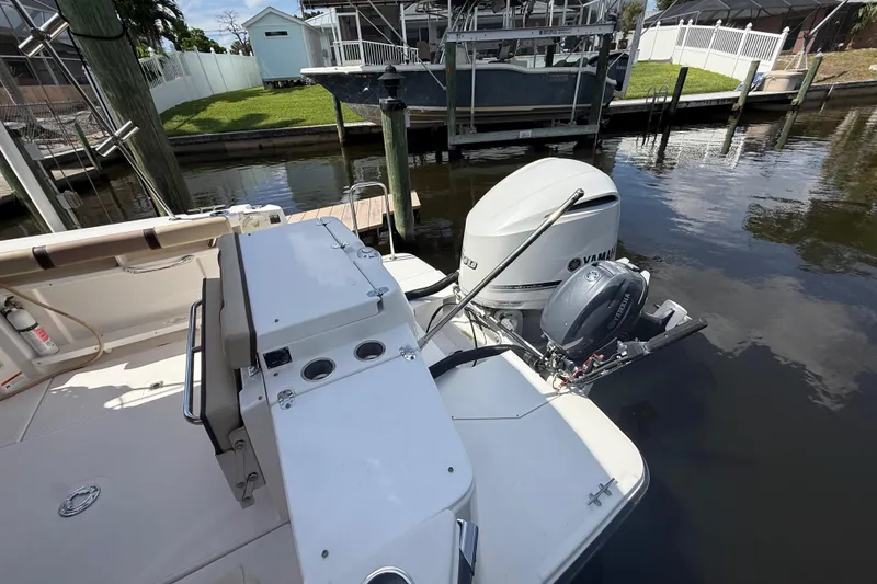 Slide: The Image of 2019 Ranger Tugs R-27 boat with Yamaha outboard motor docked in a marina. - 9