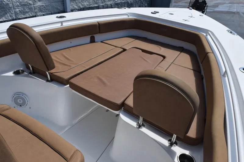 Slide: The Image of 2022 Sea Hunt Gamefish 27 Forward Seating with brown cushioned seats and spacious layout. - 11