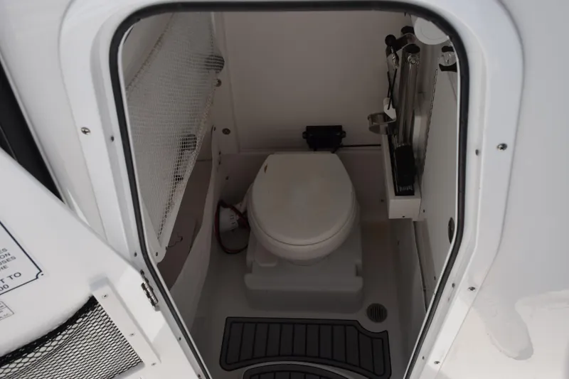 Slide: The Image of 2022 Sea Hunt Gamefish 27 boat interior with compact marine toilet. - 14