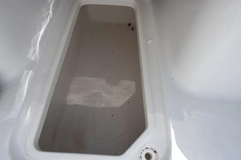 Slide: The Image of Storage compartment of 2022 Sea Hunt Gamefish 27 Forward Seating boat. - 16