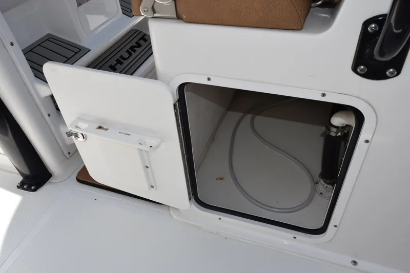 Slide: The Image of Open storage compartment on 2022 Sea Hunt Gamefish 27 boat. - 17