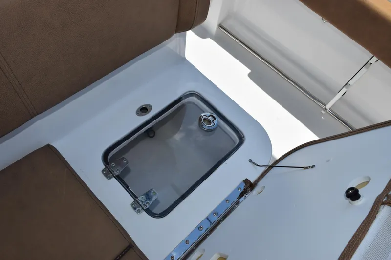 Slide: The Image of 2022 Sea Hunt Gamefish 27 Forward Seating boat interior with storage compartment. - 18