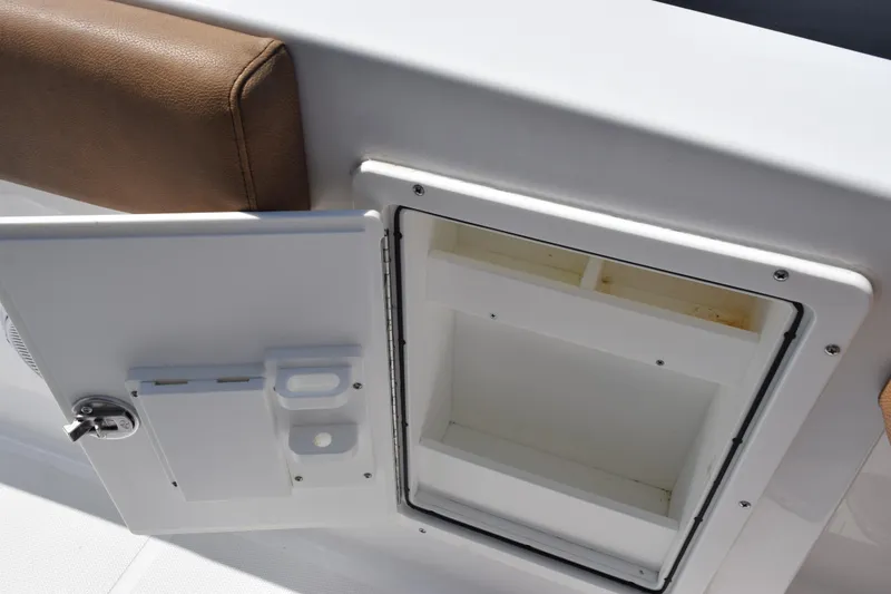 Slide: The Image of Open storage compartment on 2022 Sea Hunt Gamefish 27 Forward Seating boat. - 24