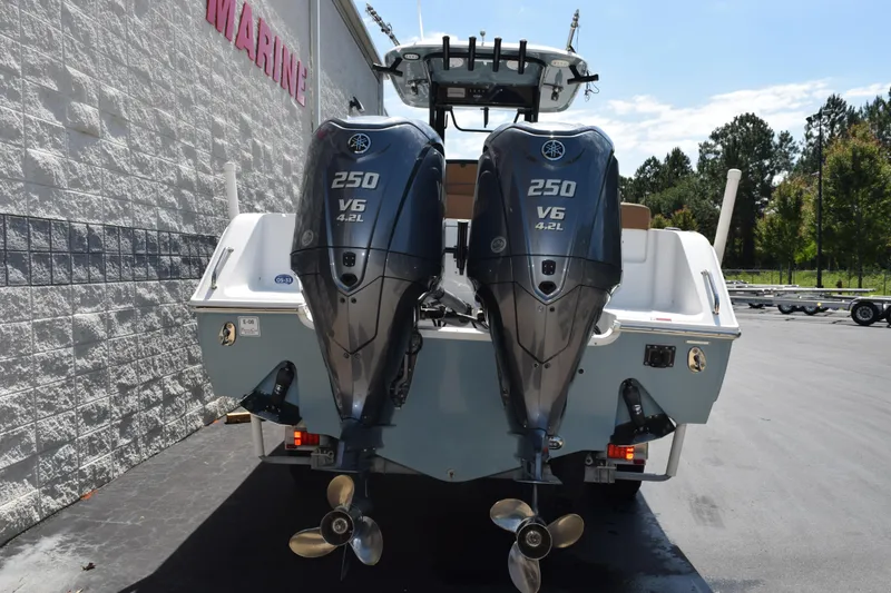 Slide: The Image of 2022 Sea Hunt Gamefish 27 with twin Yamaha 250 V6 engines, parked outdoors. - 5