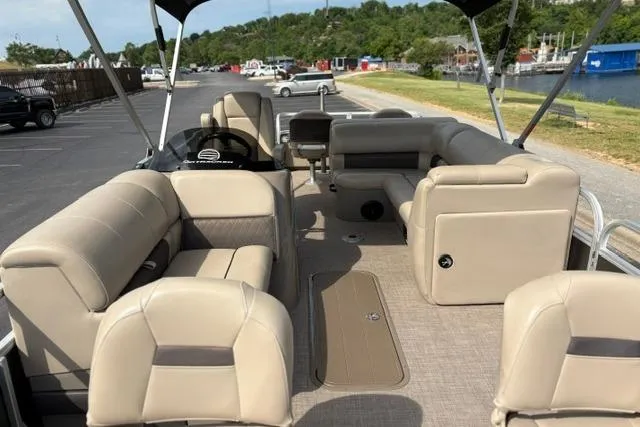Slide: The Image of 2022 Sun Tracker Fishin' Barge 22 XP3 interior with beige seating and spacious layout. - 16