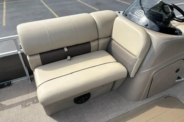 Slide: The Image of 2022 Sun Tracker Fishin' Barge 22 XP3 boat interior with beige seating and console. - 20