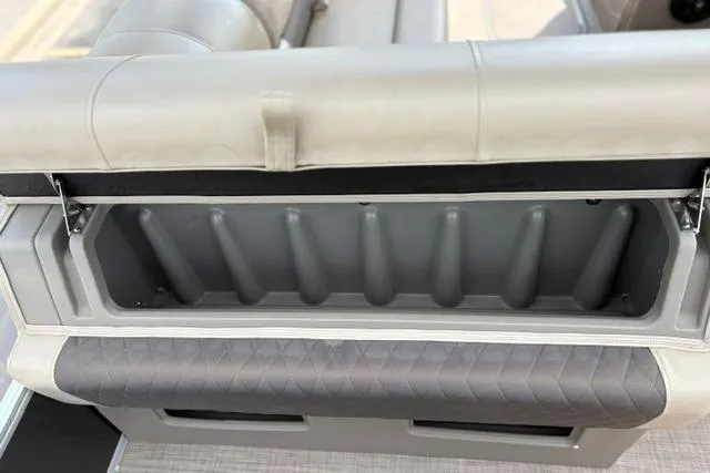 Slide: The Image of 2022 Sun Tracker Fishin' Barge 22 XP3 storage compartment with cushioned seating. - 27
