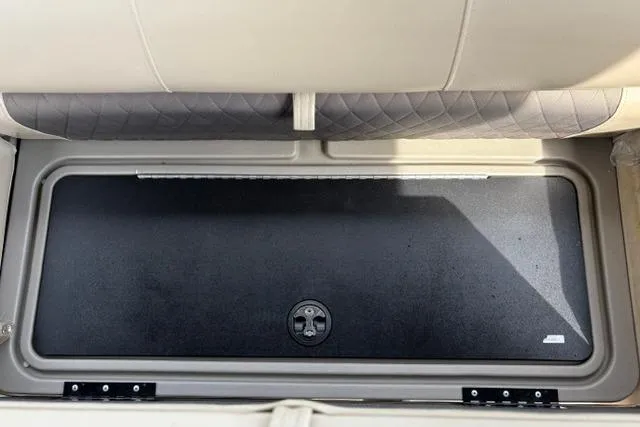 Slide: The Image of Storage compartment in 2022 Sun Tracker Fishin' Barge 22 XP3 boat, featuring cushioned seating. - 29