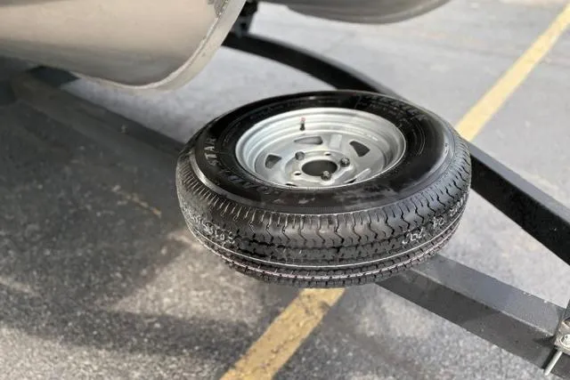 Slide: The Image of Spare tire mounted on a 2022 Sun Tracker Fishin' Barge 22 XP3 trailer. - 32