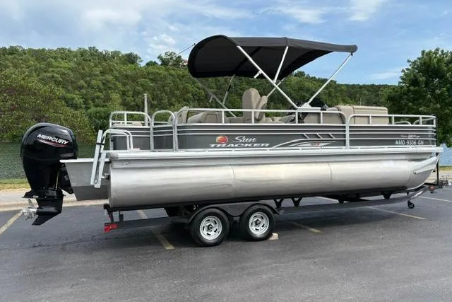 Slide: The Image of 2022 Sun Tracker Fishin' Barge 22 XP3 pontoon boat with Mercury outboard motor. - 4