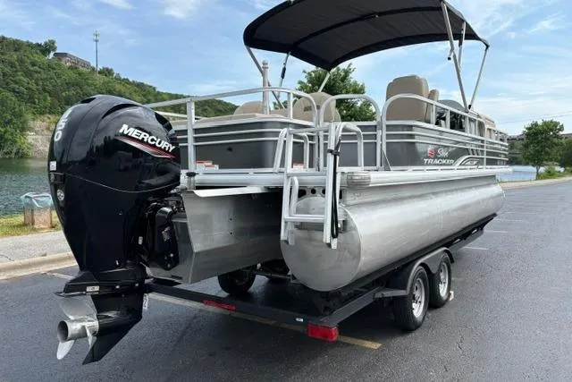 Slide: The Image of 2022 Sun Tracker Fishin' Barge 22 XP3 pontoon boat with Mercury engine on trailer. - 8
