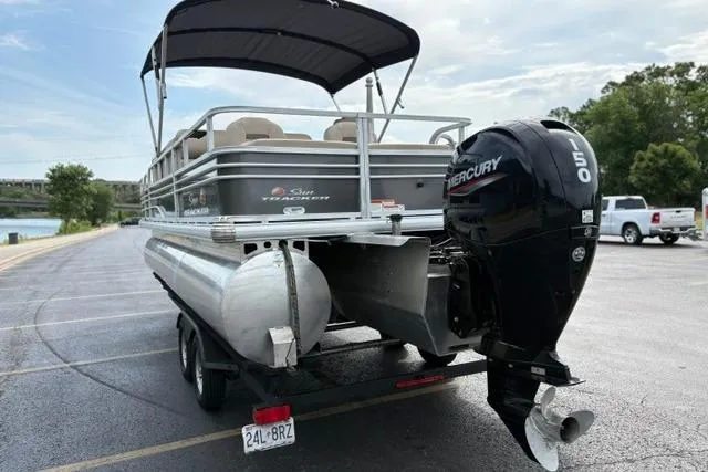 Slide: The Image of 2022 Sun Tracker Fishin' Barge 22 XP3 pontoon boat with Mercury 150 engine on trailer. - 9