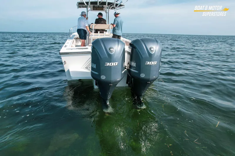 Slide: The Image of 2015 Parker 2801 Center Console boat with dual Yamaha 300 engines on open water. - 10