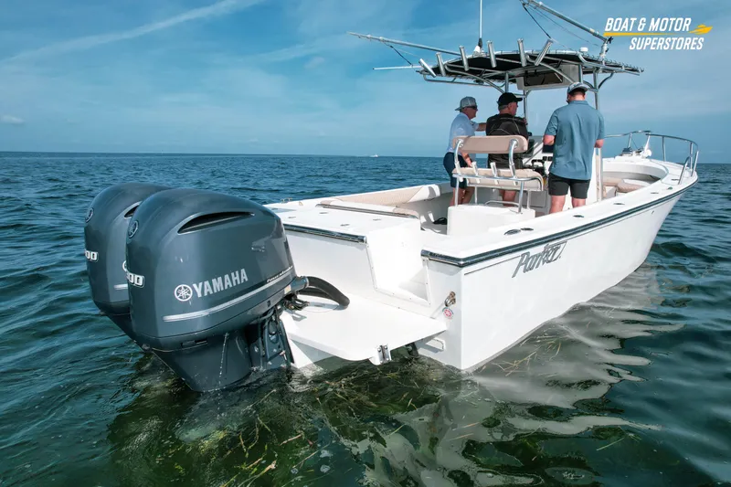 Slide: The Image of 2015 Parker 2801 Center Console boat with Yamaha engines on open water. - 11