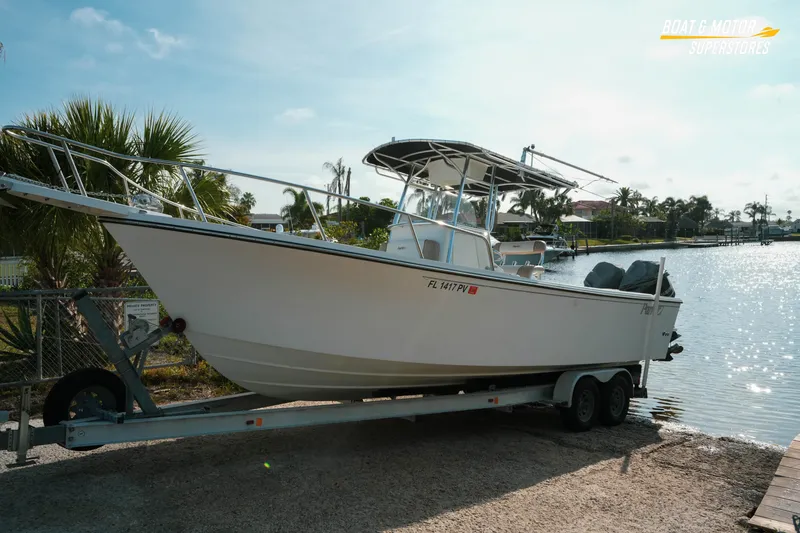 Slide: The Image of 2015 Parker 2801 Center Console boat on trailer by waterfront, sunny day. - 18