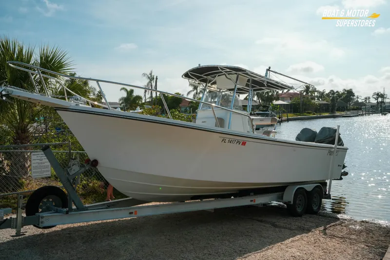 Slide: The Image of 2015 Parker 2801 Center Console boat on trailer by waterfront, sunny day. - 19