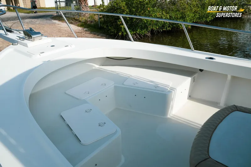 Slide: The Image of 2015 Parker 2801 Center Console boat interior with seating and storage compartments. - 22