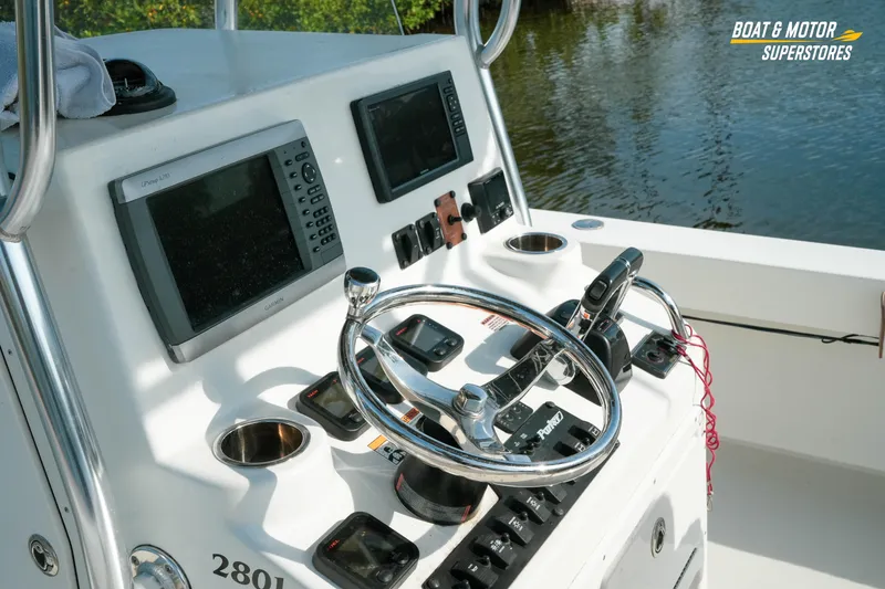 Slide: The Image of Control panel of a 2015 Parker 2801 Center Console boat with navigation equipment. - 23