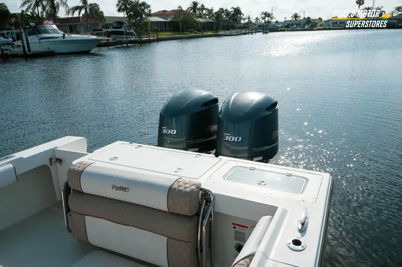 Slide: The Image of 2015 Parker 2801 Center Console boat with twin Yamaha 300 engines on a sunny waterway. - 25