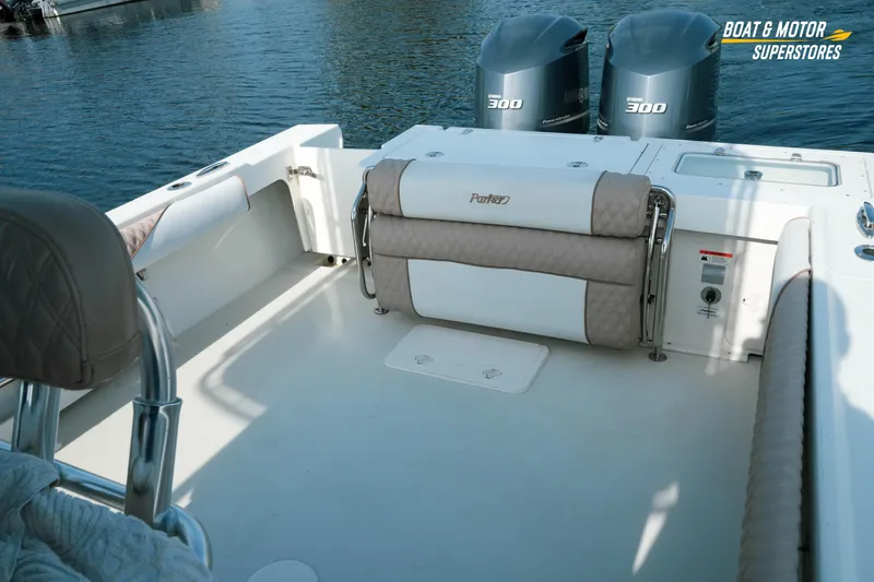 Slide: The Image of 2015 Parker 2801 Center Console boat with dual Yamaha 300 engines, docked on calm water. - 27