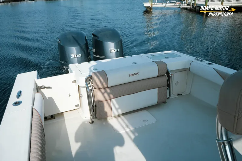 Slide: The Image of 2015 Parker 2801 Center Console boat with twin 300 horsepower engines on calm water. - 34