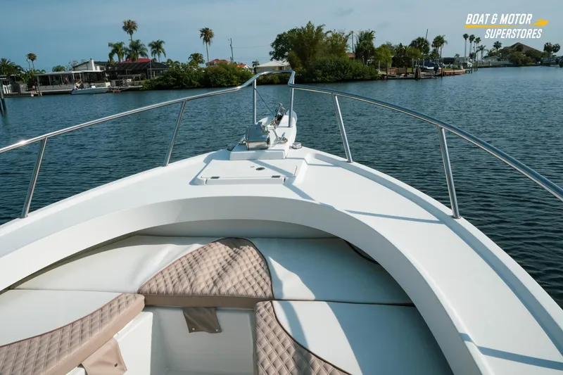 Slide: The Image of 2015 Parker 2801 Center Console boat on calm water, featuring spacious seating and sleek design. - 37