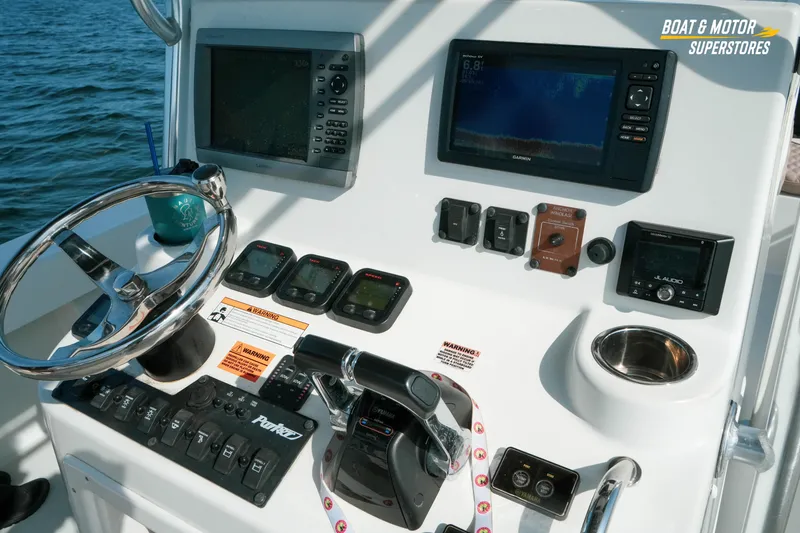 Slide: The Image of Center console of a 2015 Parker 2801 boat with navigation and control systems. - 44