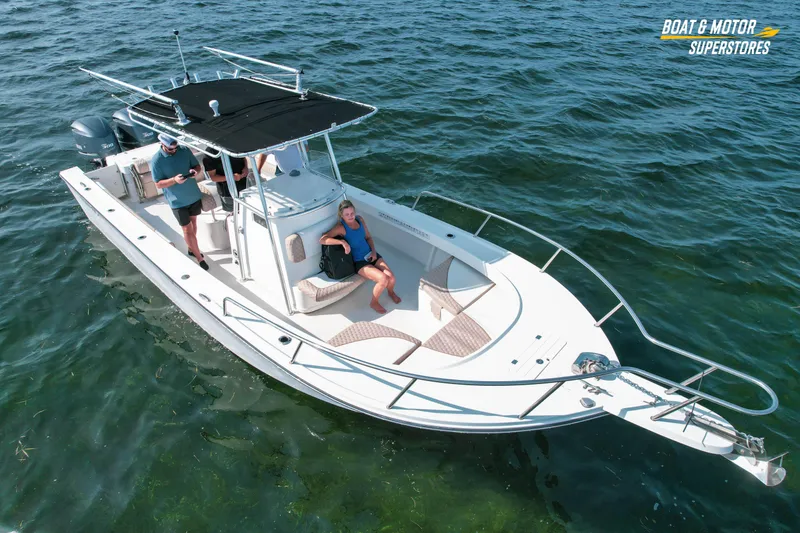 Slide: The Image of 2015 Parker 2801 Center Console boat on water with passengers relaxing. - 5