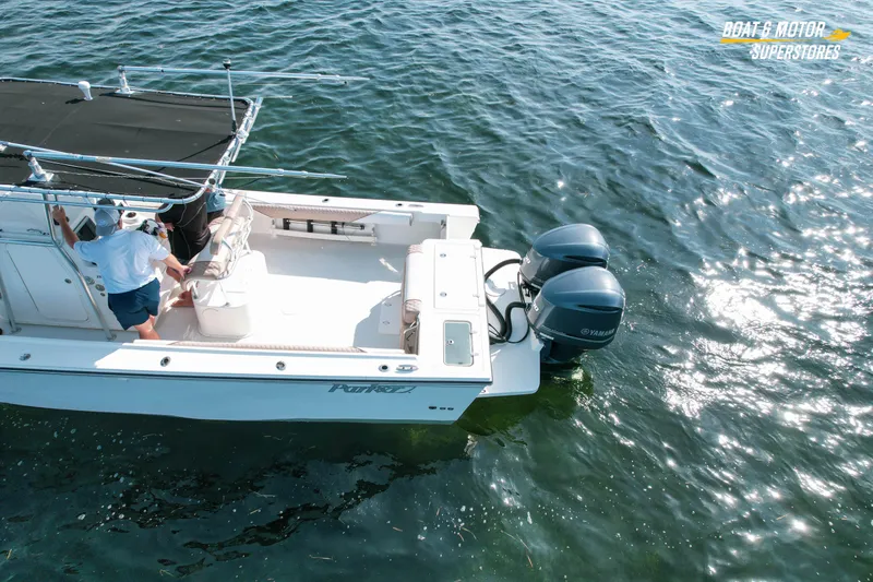 Slide: The Image of 2015 Parker 2801 Center Console boat on water with dual Yamaha engines. - 7