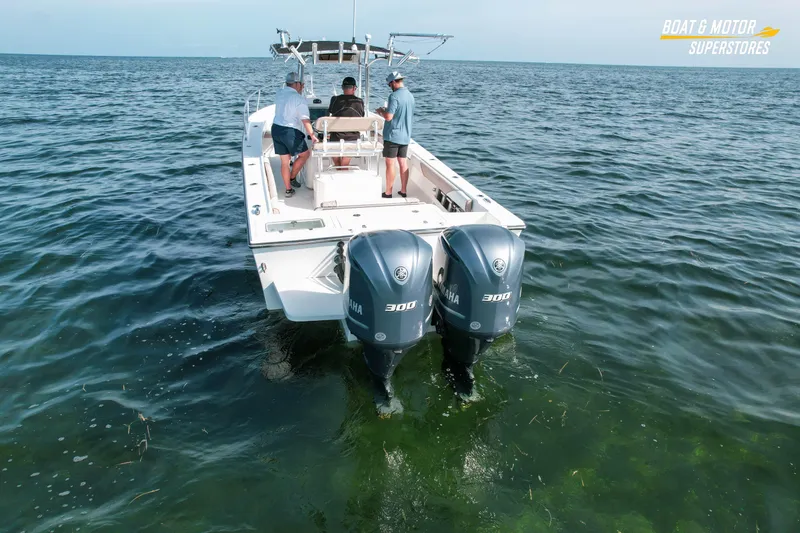 Slide: The Image of 2015 Parker 2801 Center Console boat with dual Yamaha engines on open water. - 9