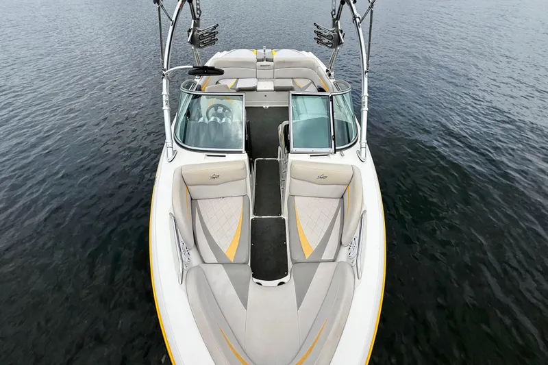 Slide: The Image of 2009 MasterCraft X30 boat on water, featuring sleek design and comfortable seating. - 19