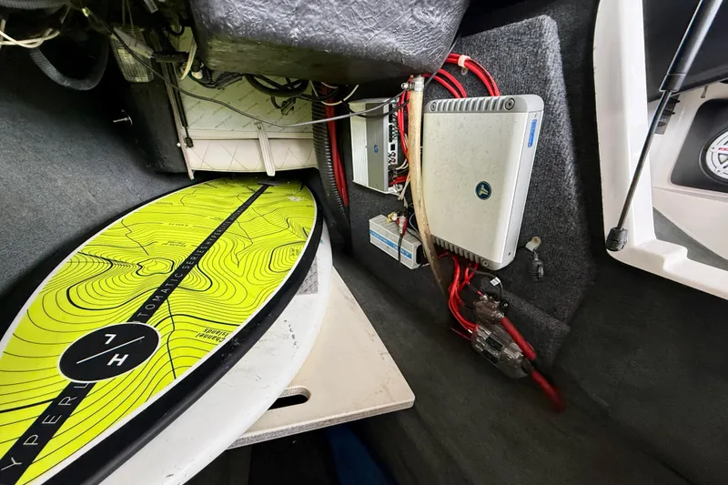 Slide: The Image of Interior of a 2009 MasterCraft X30 boat with surfboard and electronic equipment. - 26