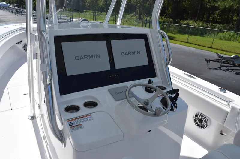 Slide: The Image of 2026 Contender 32 ST boat console with dual Garmin displays and steering wheel. - 10