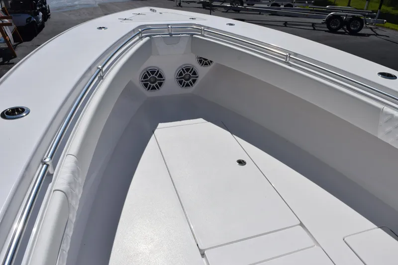 Slide: The Image of 2026 Contender 32 ST boat interior with sleek white deck and stainless steel railings. - 13