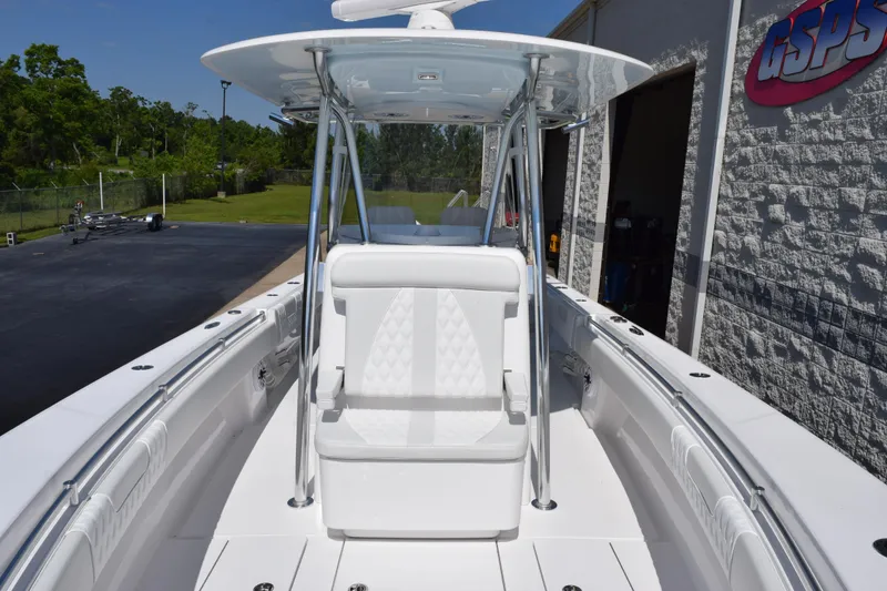 Slide: The Image of 2026 Contender 32 ST boat with sleek white seating and modern design. - 14